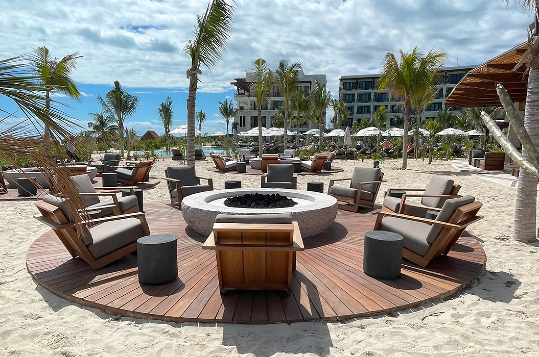 Sea side terrace reception venue with a central fire pit at Secrets Playa Blanca, Cancun