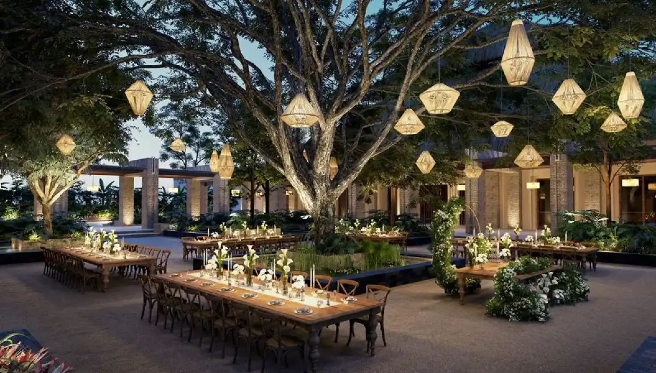 Plaza wedding reception under lit trees at Secrets Playa Blanca, Cancun
