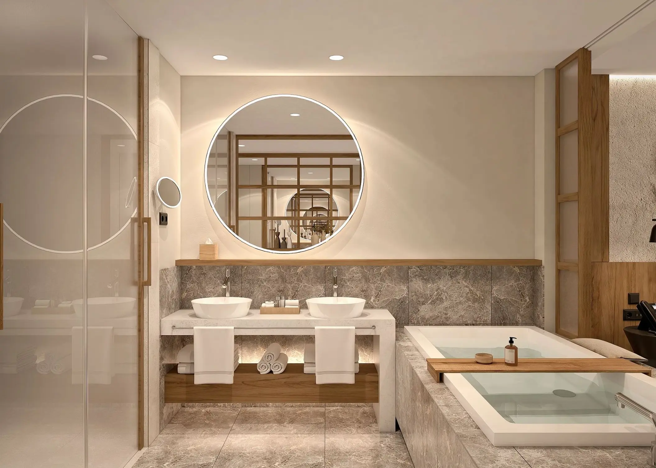 A modern bathroom with a double sink vanity, a large round illuminated mirror, and a spacious bathtub.