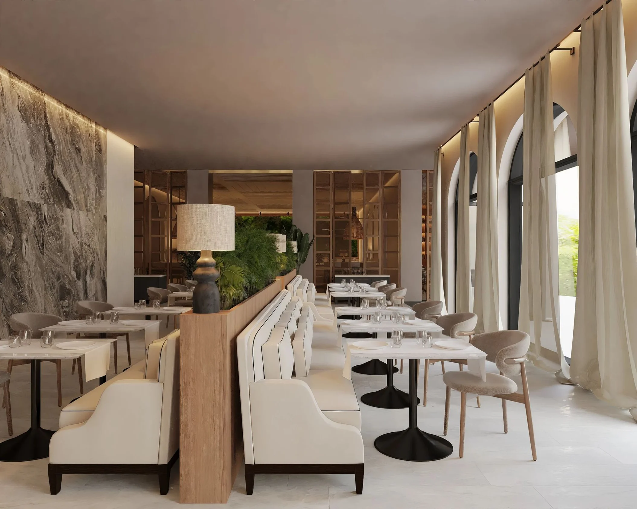 The Market Cafe restaurant, a bright and modern dining space with booths and arched windows with curtains.