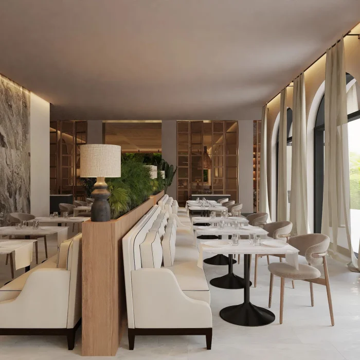 The Market Cafe restaurant, a bright and modern dining space with booths and arched windows with curtains.