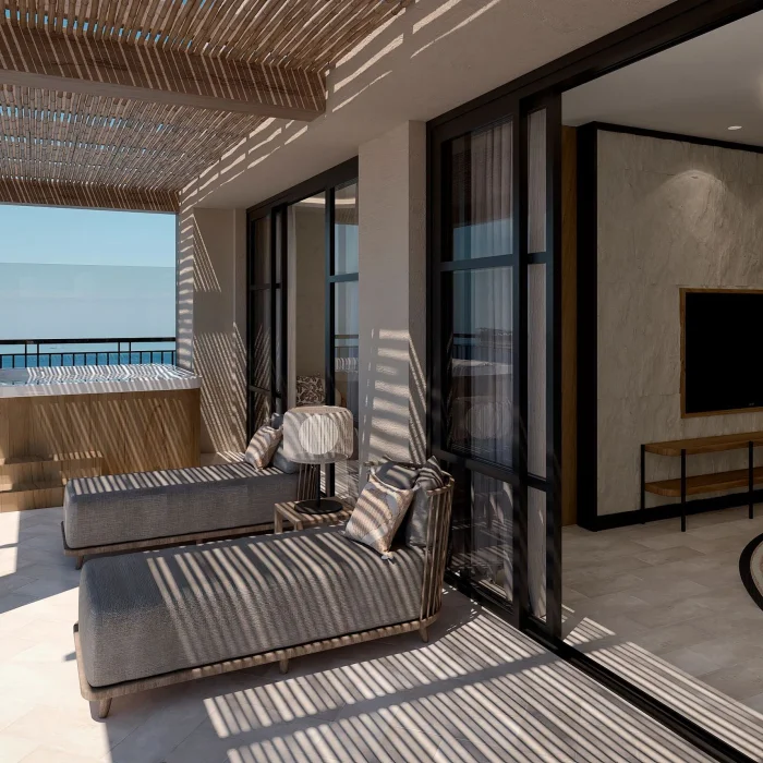 A luxurious presidential suite balcony with lounge chairs and a hot tub, with an ocean view.