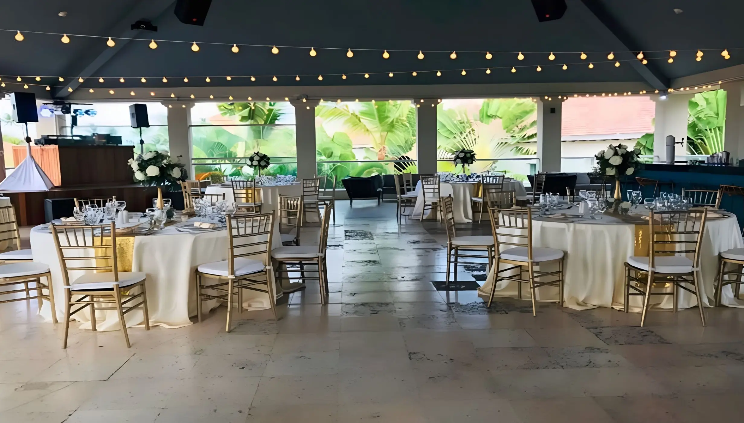 Eclipse Nightclub wedding reception setup with gold chairs and string lights at Secrets Royal Beach, Punta Cana