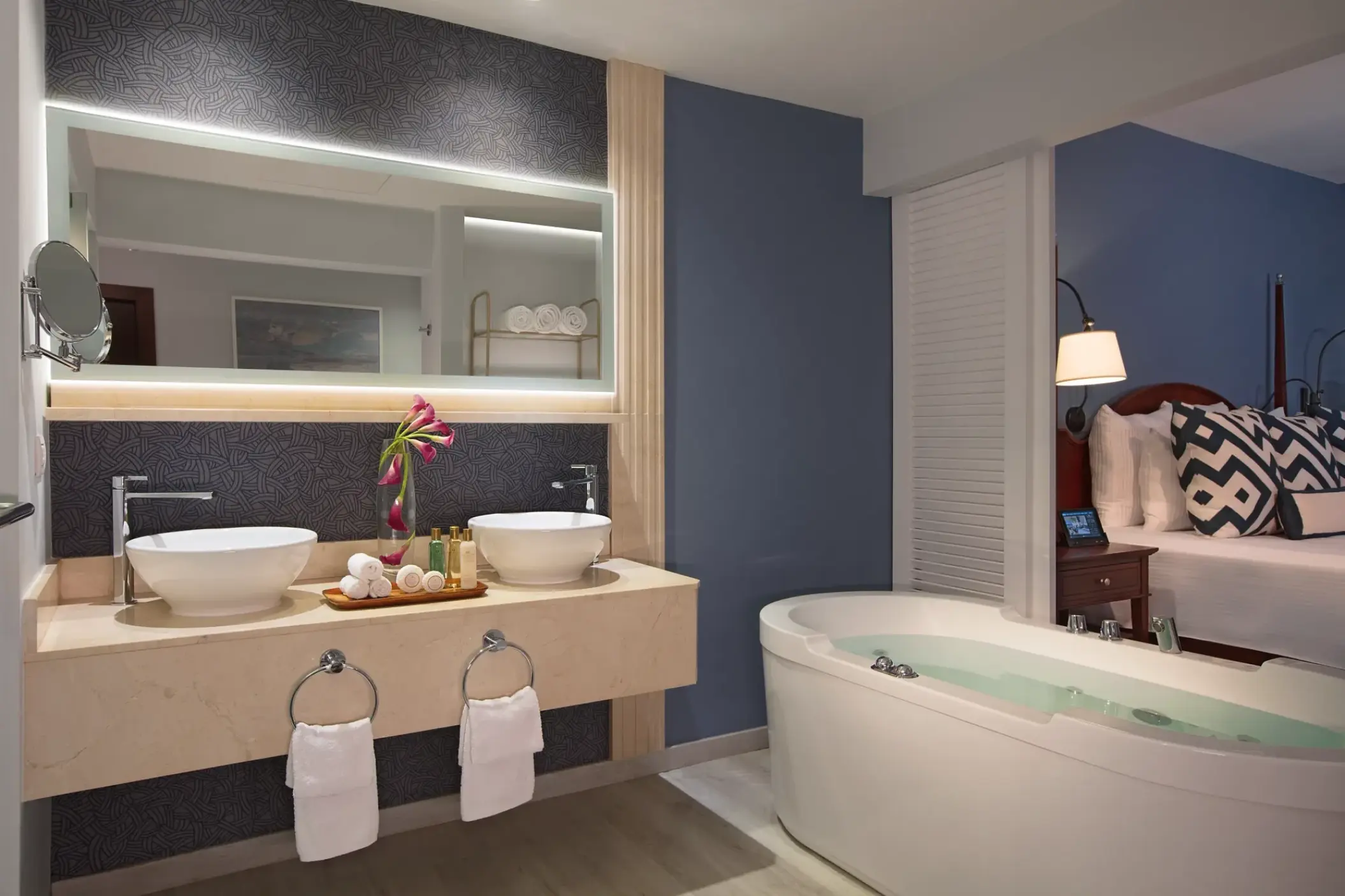 Junior Suite bathroom with dual sinks and a soaking tub at Secrets St James, Montego Bay