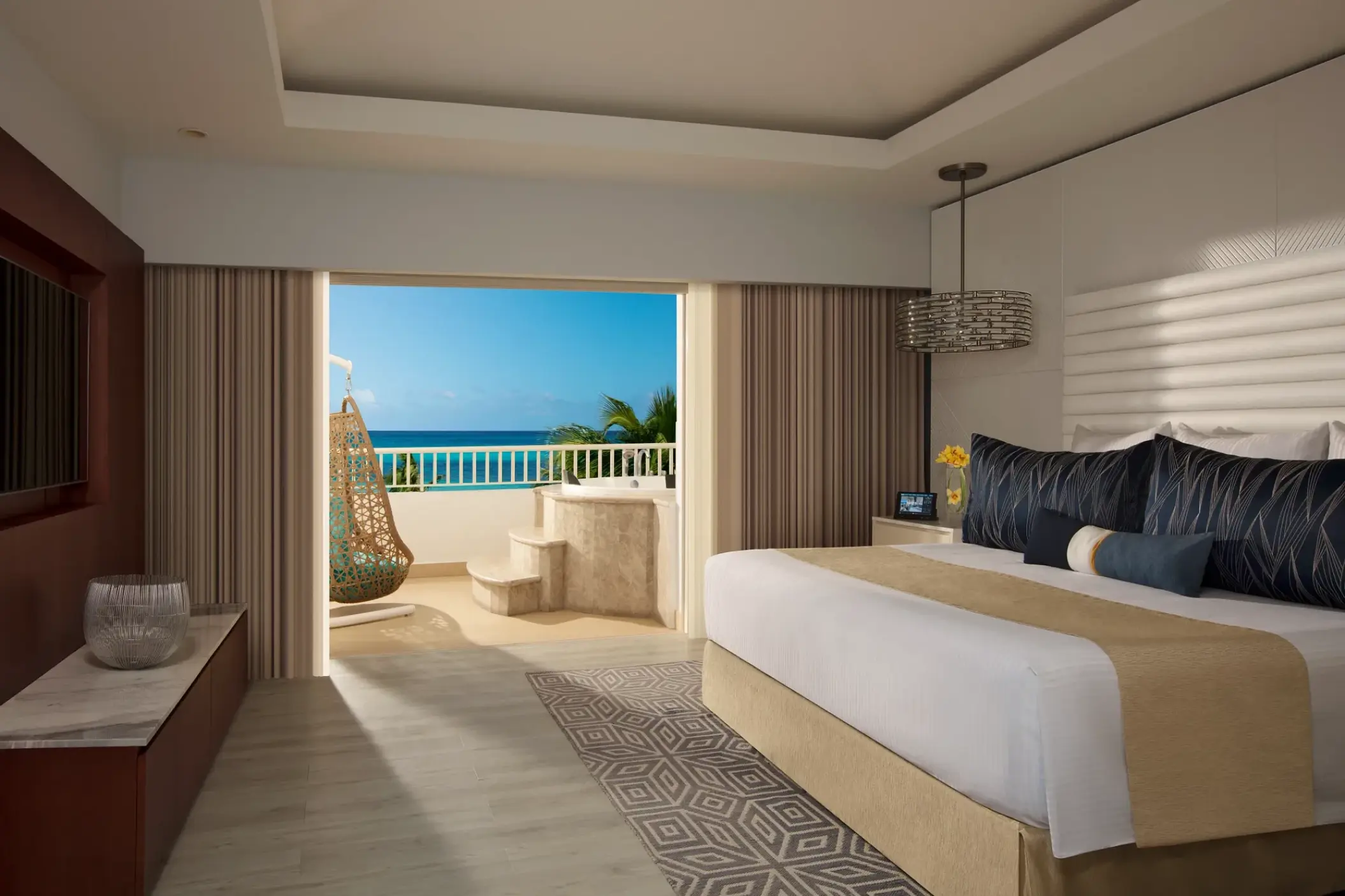 Presidential suite bedroom at Secrets St James Montego Bay with ocean-view balcony and soaking tub