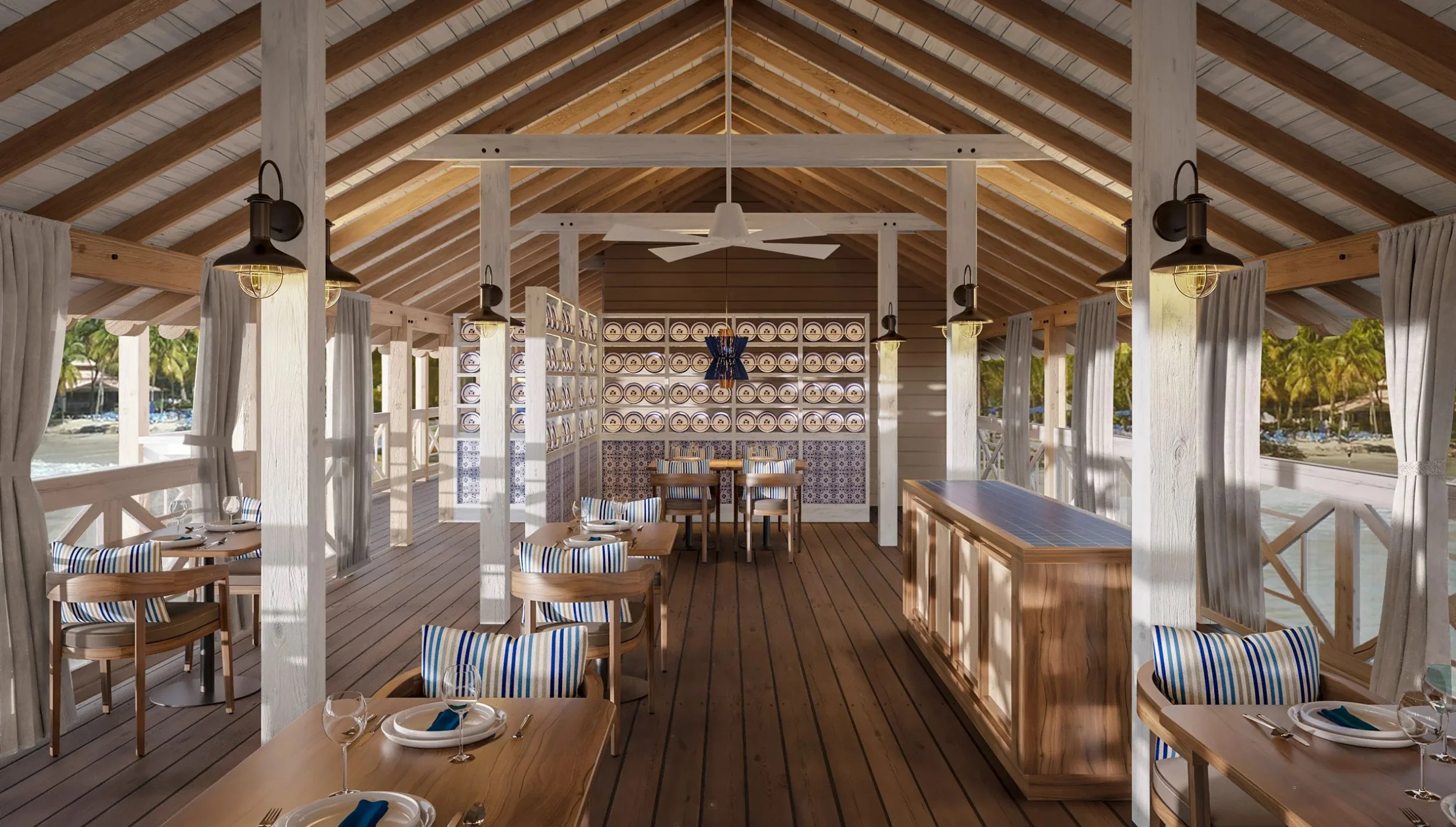 An elegant open-air restaurant and venue on a pier, with a bar and views of the sea.