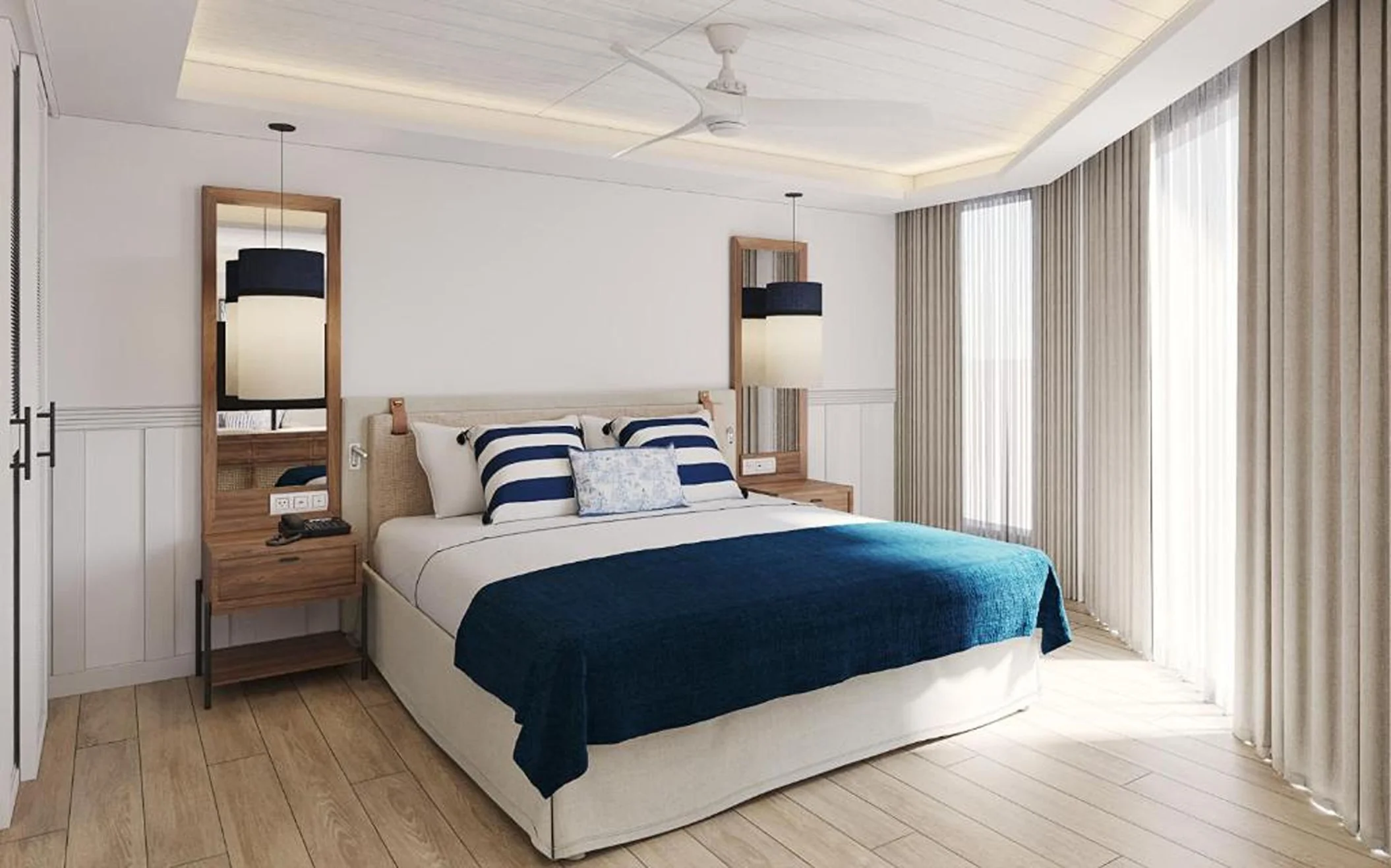 A serene hotel bedroom with a king-sized bed, white and blue bedding, and two matching nightstands.