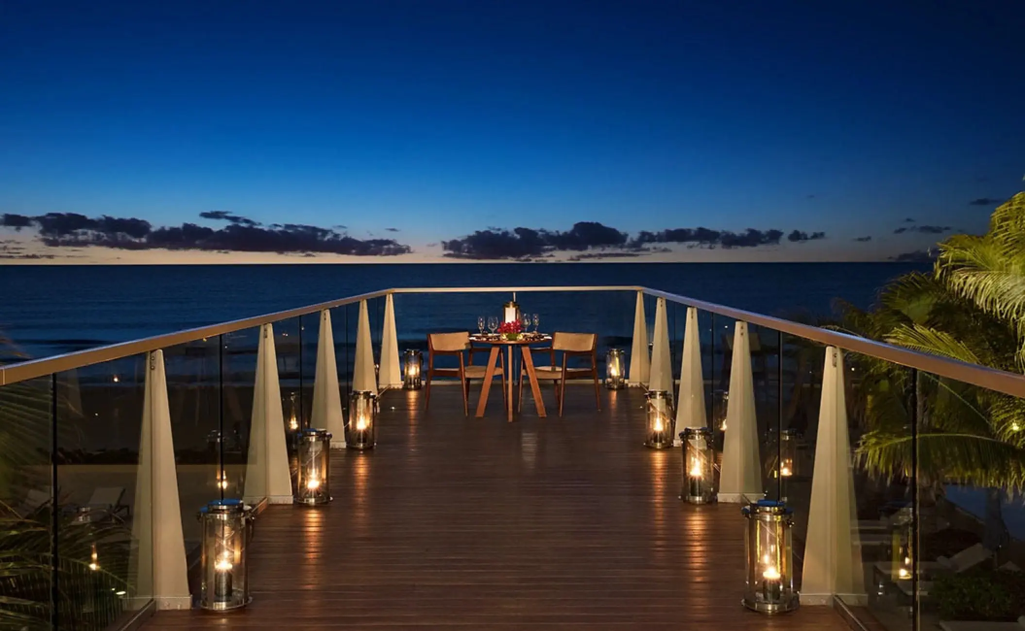 Private romantic dinner setup on a terrace at sunset, Secrets The Vine, Cancun
