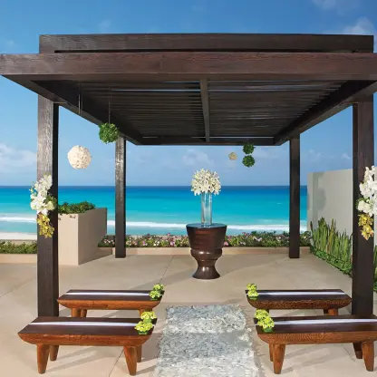 Terrace wedding ceremony gazebo with ocean views at Secrets The Vine, Cancun