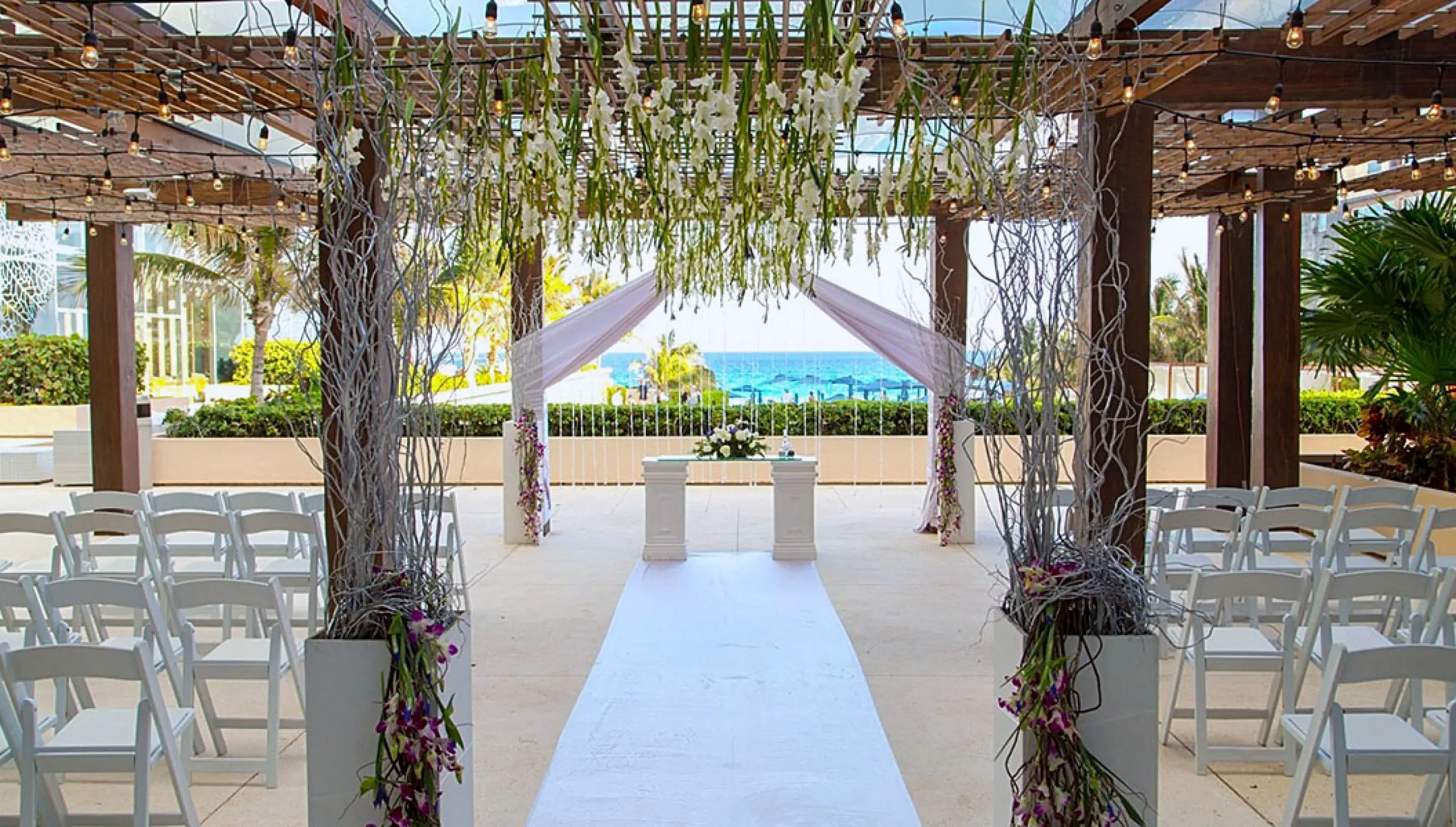 Ceremony setup at The Vine Terrace wedding venue at Secrets The Vine Cancun.