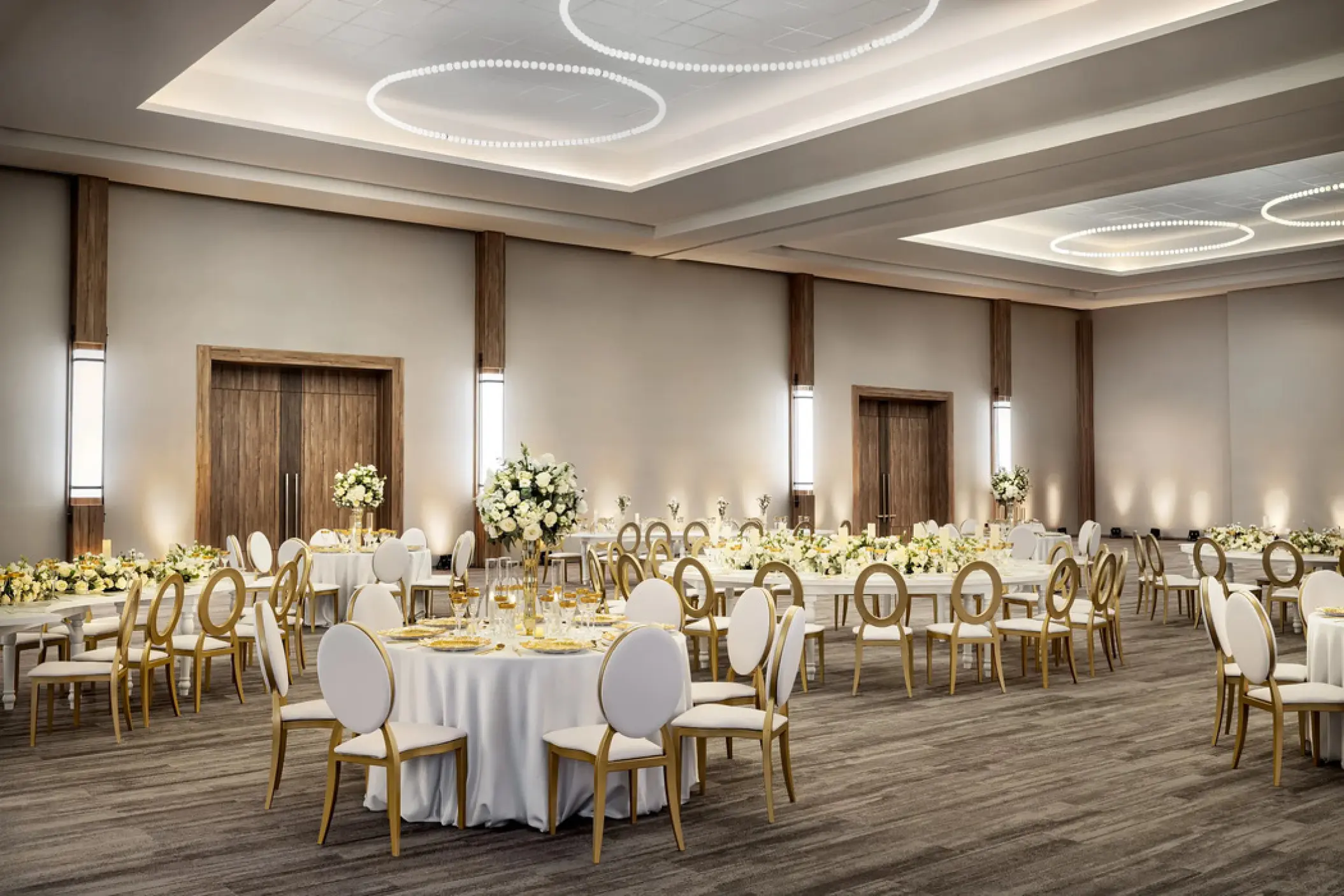 Ballroom wedding reception with round tables and white floral centerpieces at Secrets Tides, Punta Cana