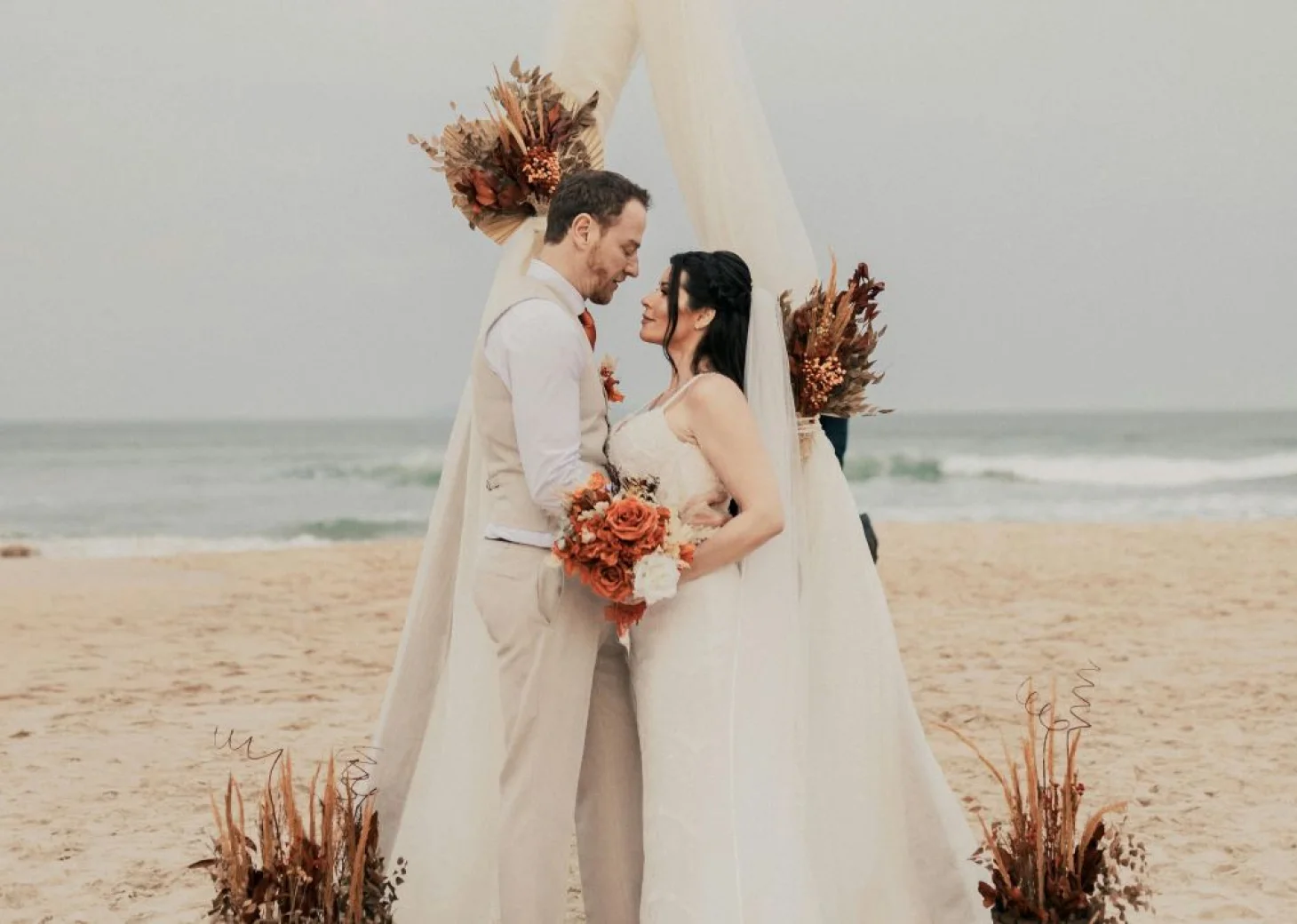 groom and bride on the beach