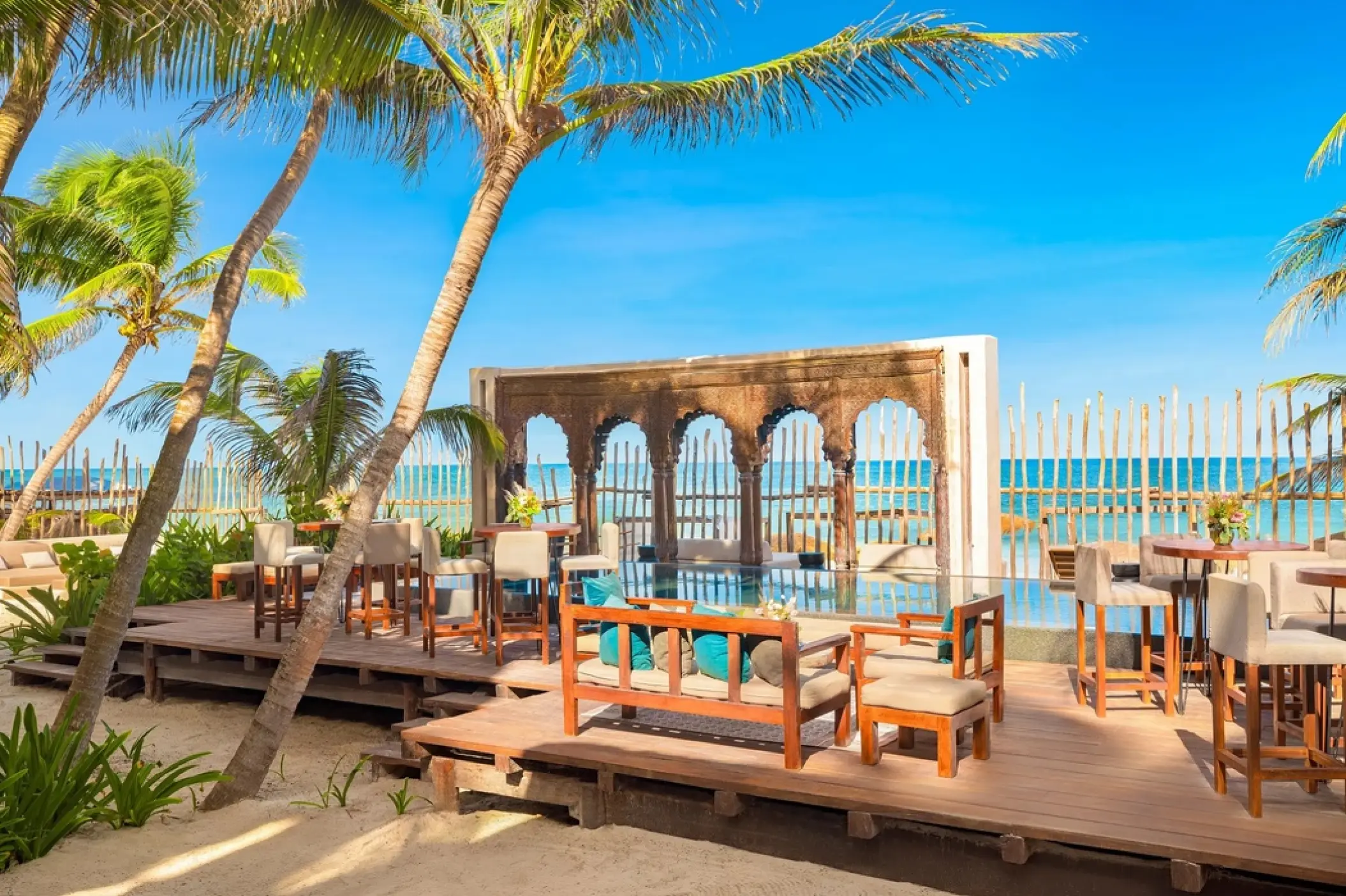 Casa Zamna pool and beach club lounge with stone arches at Secrets Tulum, Tulum