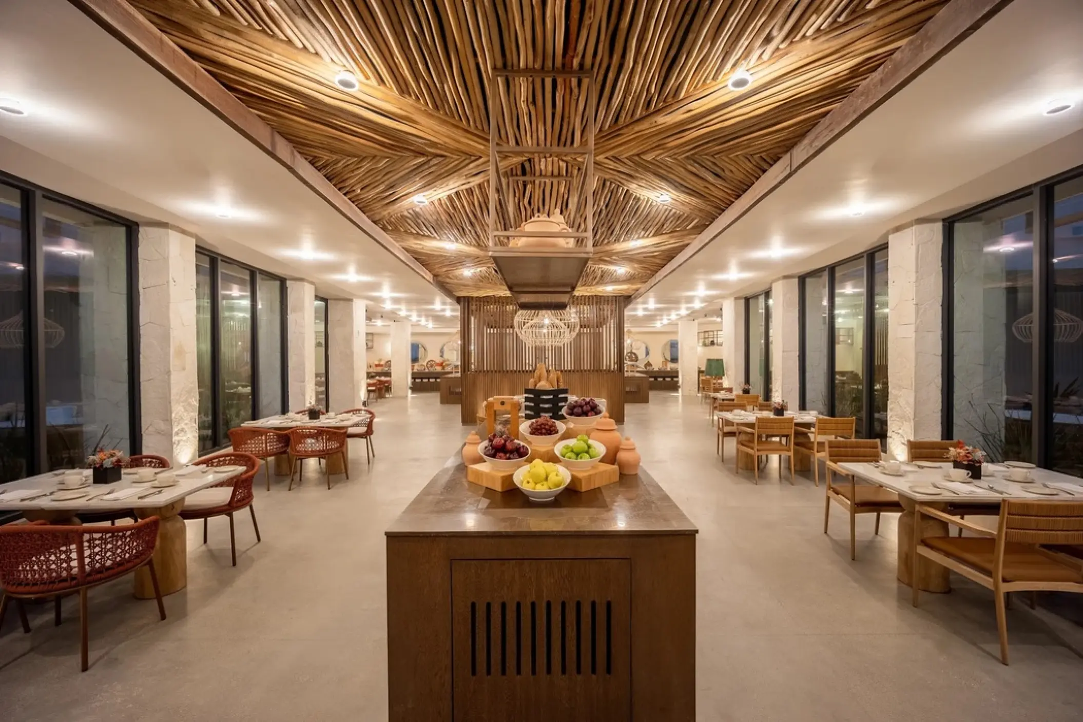 Market Cafe buffet area with decorative branch ceiling at Secrets Tulum