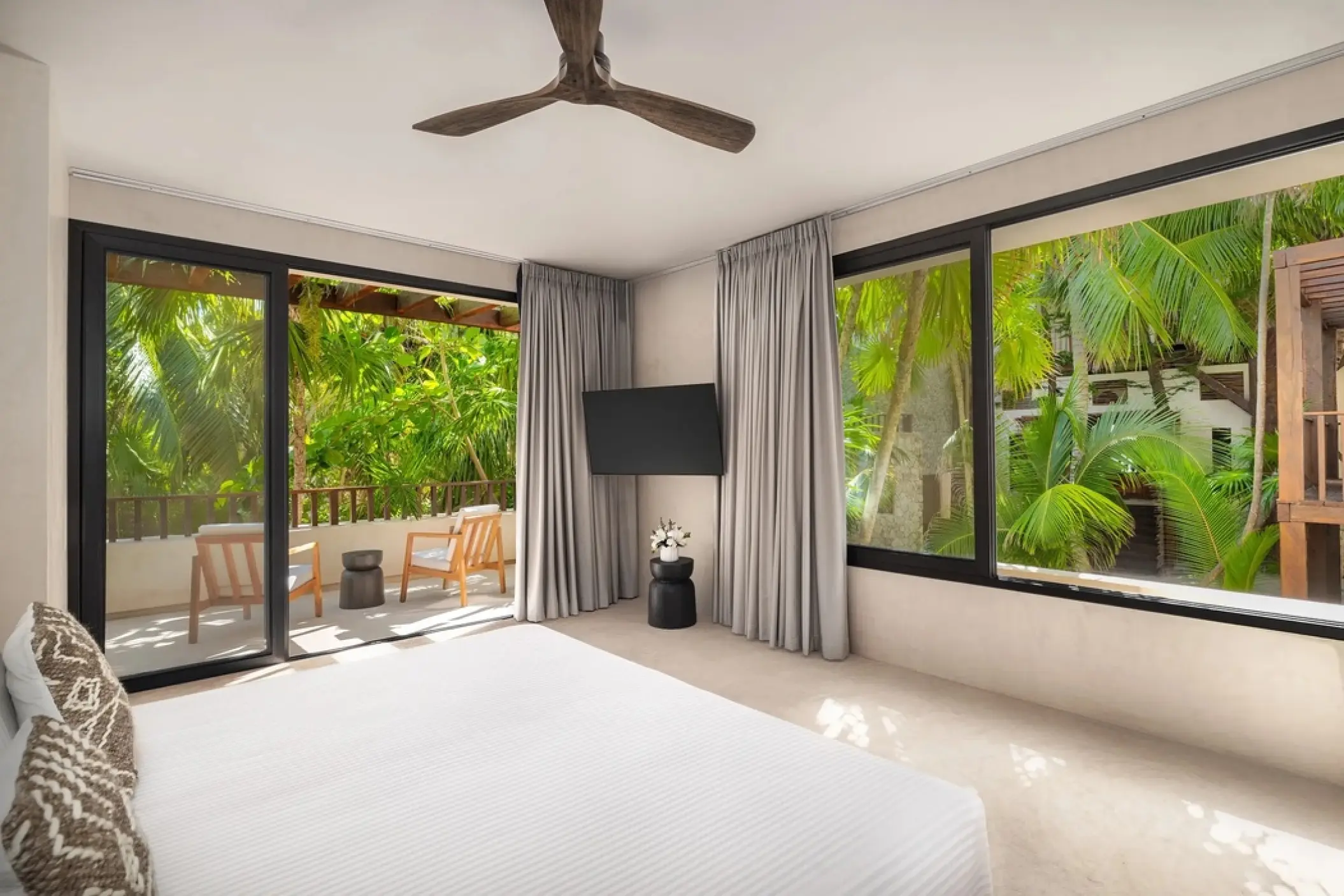Tropical View Suite with a private balcony and lush garden views at Secrets Tulum, Tulum