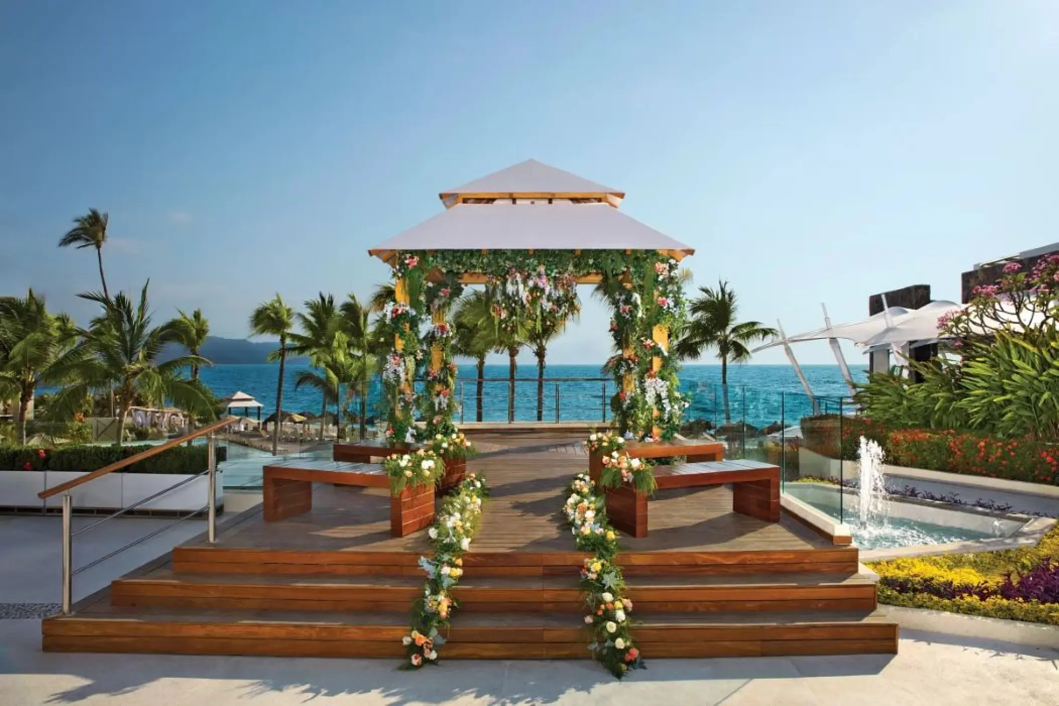 Oceanfront wedding ceremony gazebo with floral decor at Secrets Vallarta Bay, Puerto Vallarta