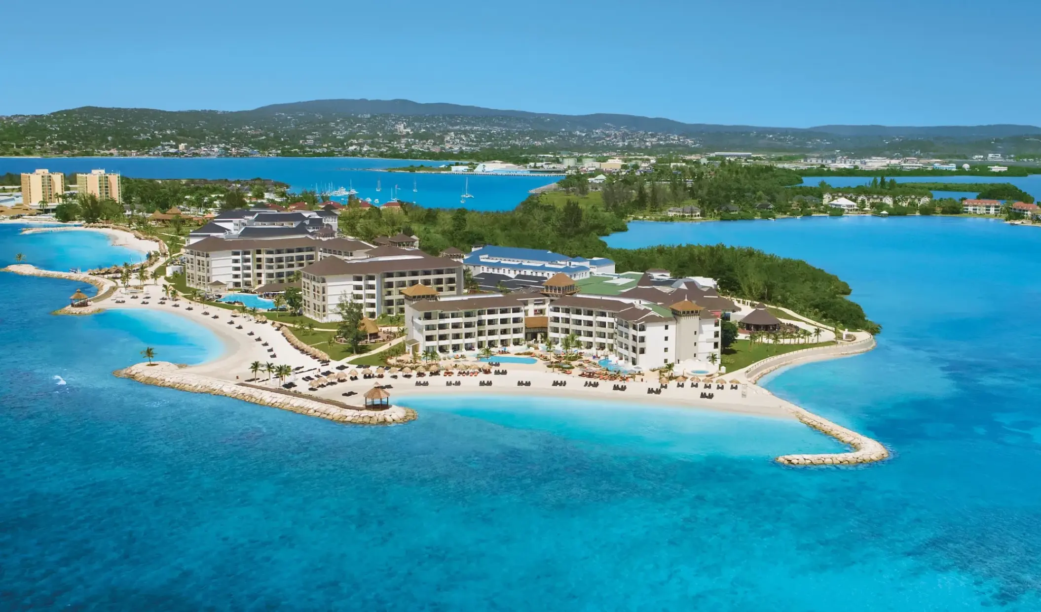 Aerial view of Secrets Wild Orchid on a white sand peninsula, Montego Bay