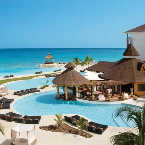 Secrets Wild Orchid Montego Bay beachfront swimming pool and thatched swim-up bar, Montego Bay