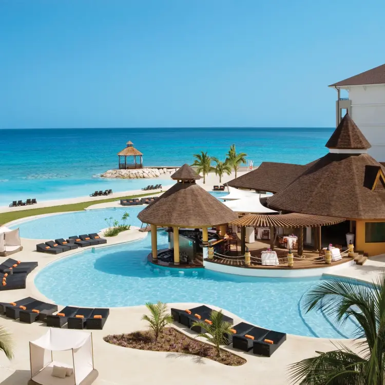 Secrets Wild Orchid Montego Bay beachfront swimming pool and thatched swim-up bar, Montego Bay