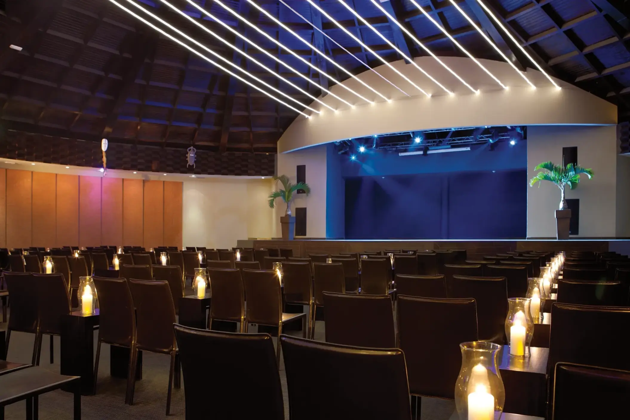 Indoor theater with candlelit seating at Secrets Wild Orchid, Montego Bay