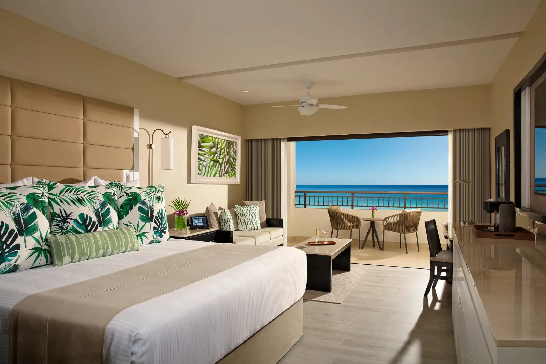 Secrets Wild Orchid junior suite bedroom opening onto an ocean view balcony, Montego Bay