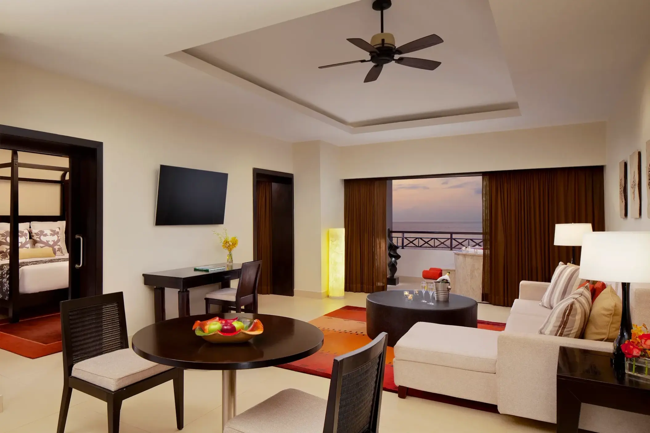 Master suite living area with ocean view balcony at Secrets Wild Orchid, Montego Bay