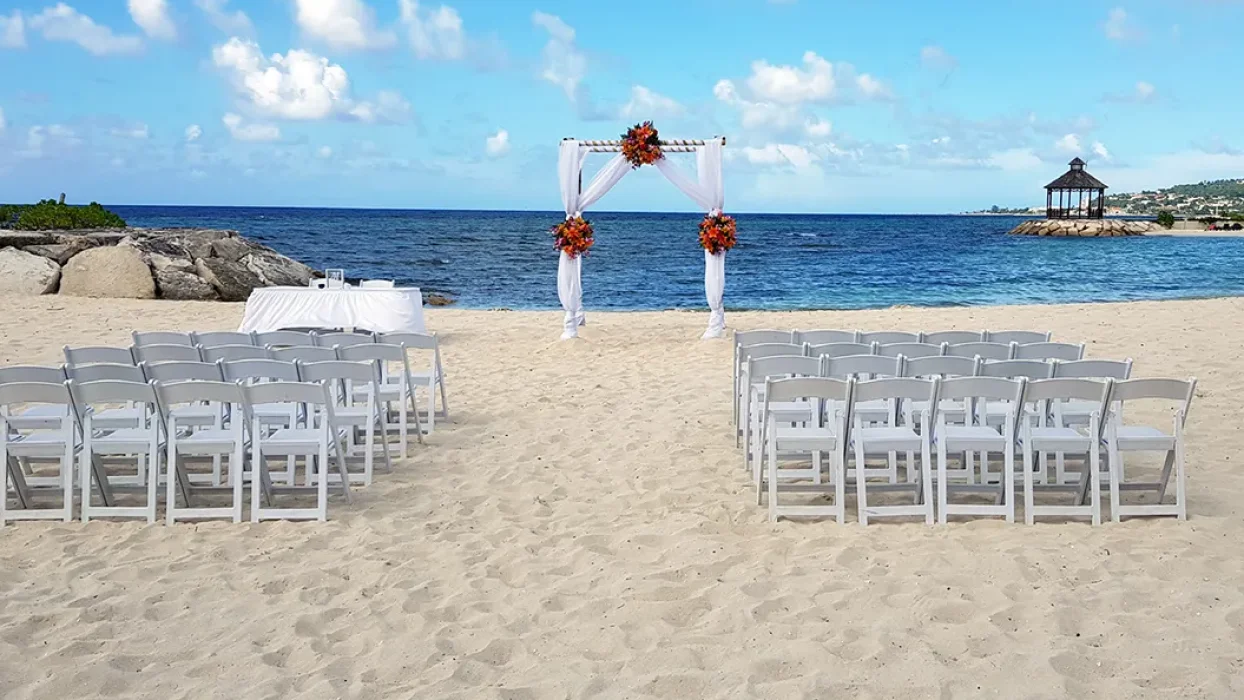 Ceremony setup on the Barracuda beach venue at Secrets Wild Orchid.