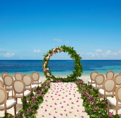 Ceremony setup on the Barracuda beach venue at Secrets Wild Orchid.