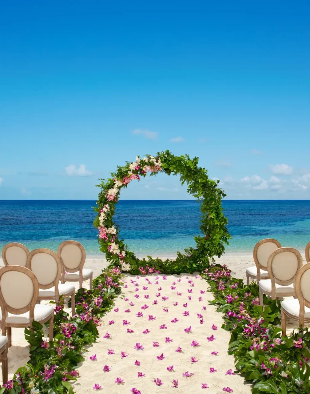 Ceremony setup on the Barracuda beach venue at Secrets Wild Orchid.
