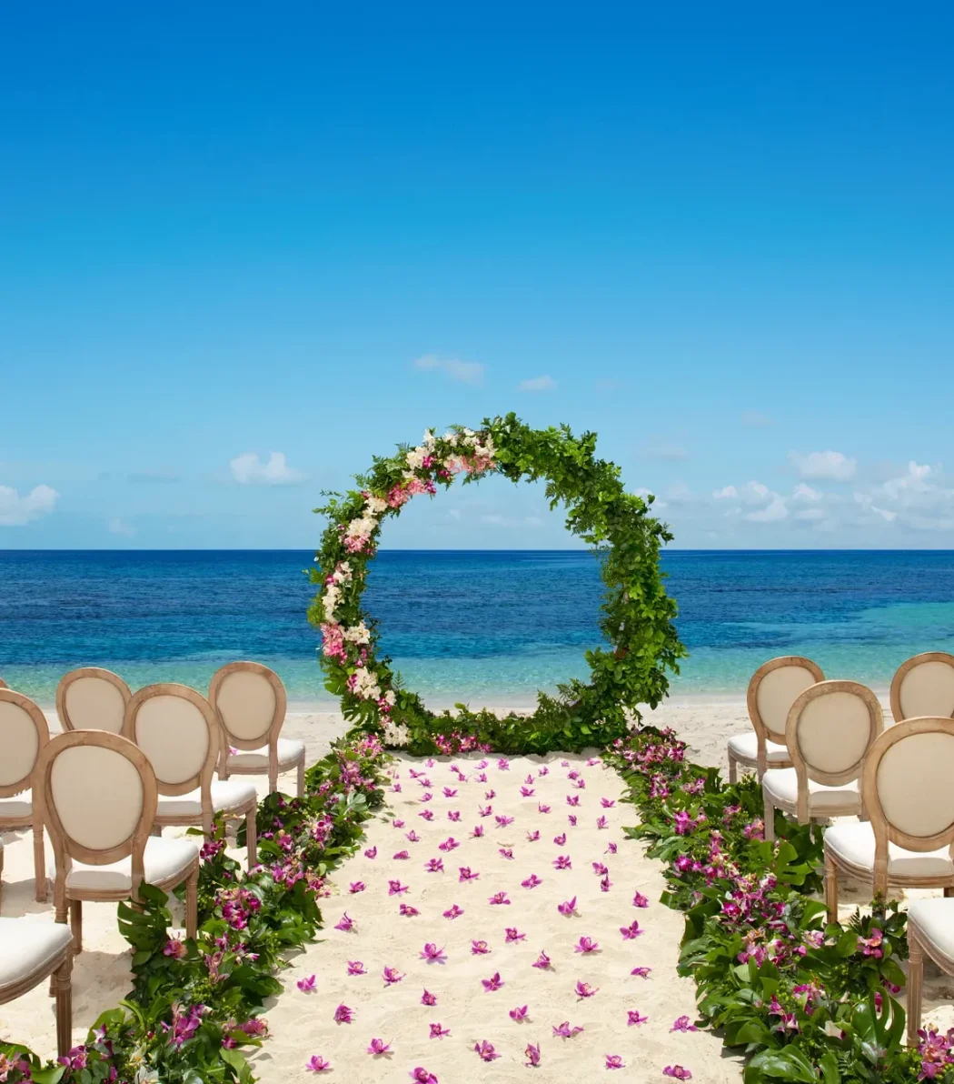 Ceremony setup on the Barracuda beach venue at Secrets Wild Orchid.