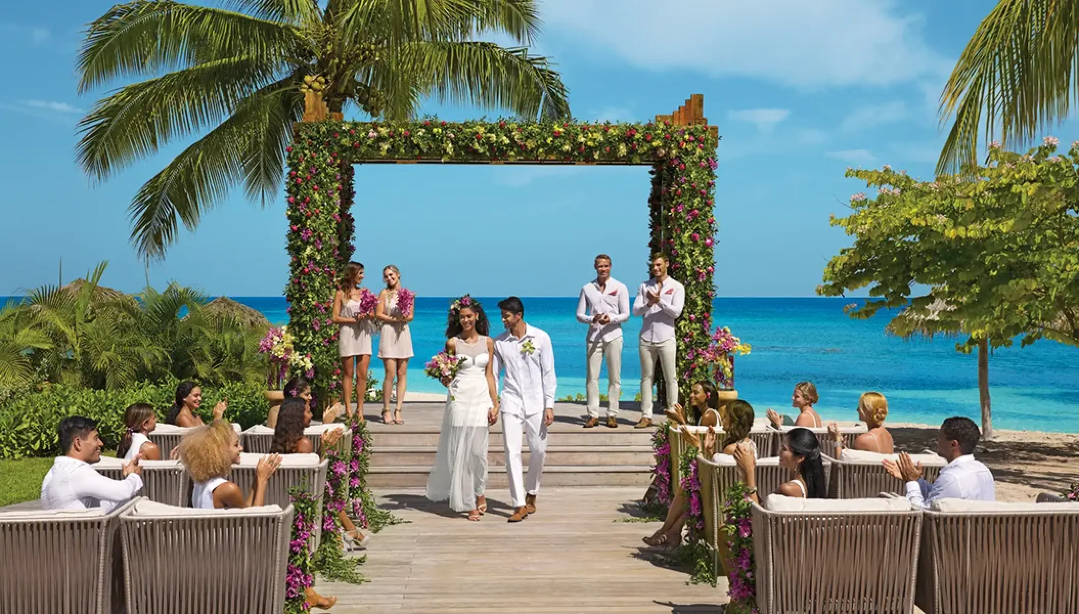 Outdoor wedding ceremony under a floral gazebo at Secrets St James, Montego Bay