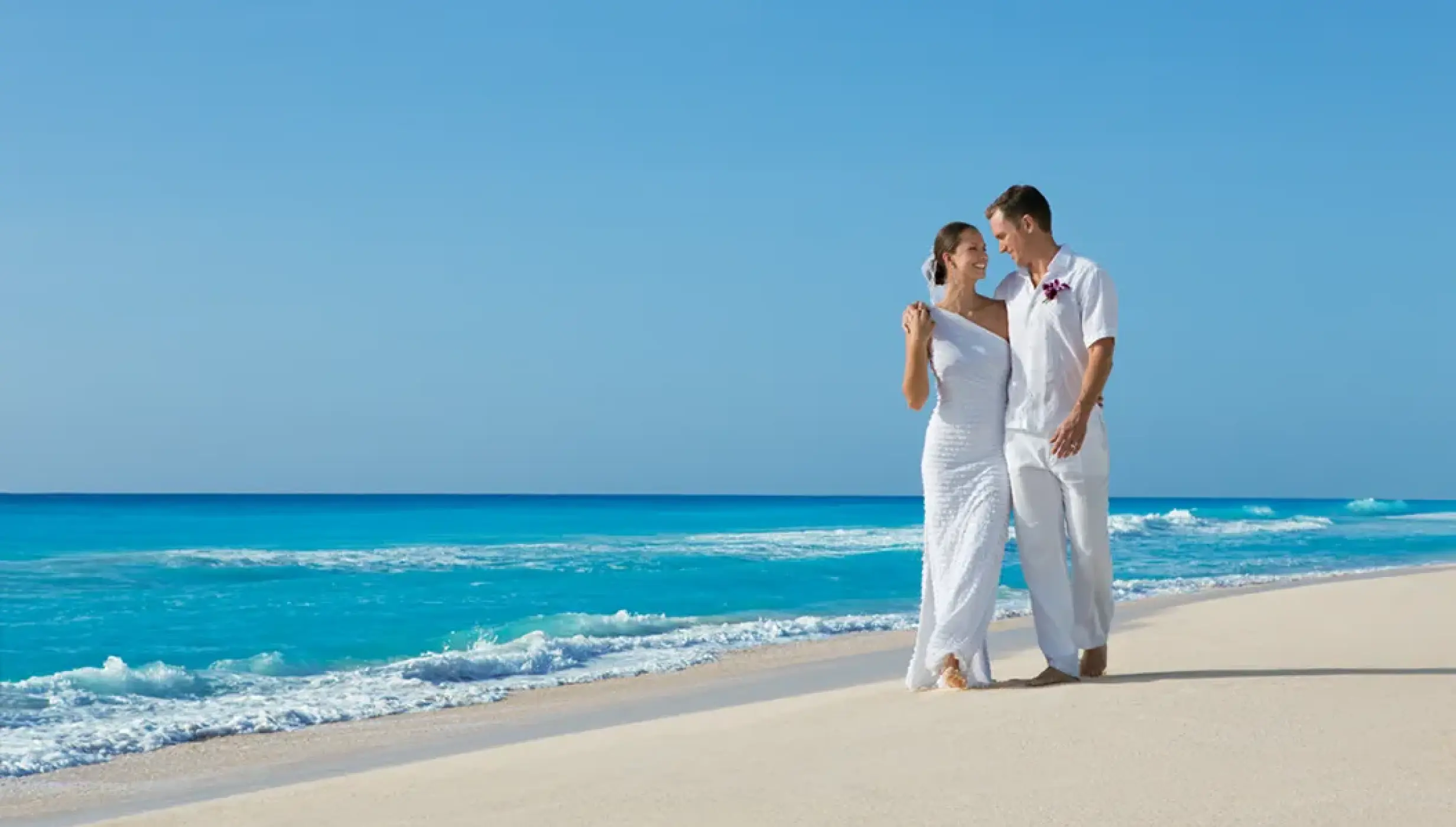 Ceremony setup on the Barracuda beach venue at Secrets Wild Orchid.