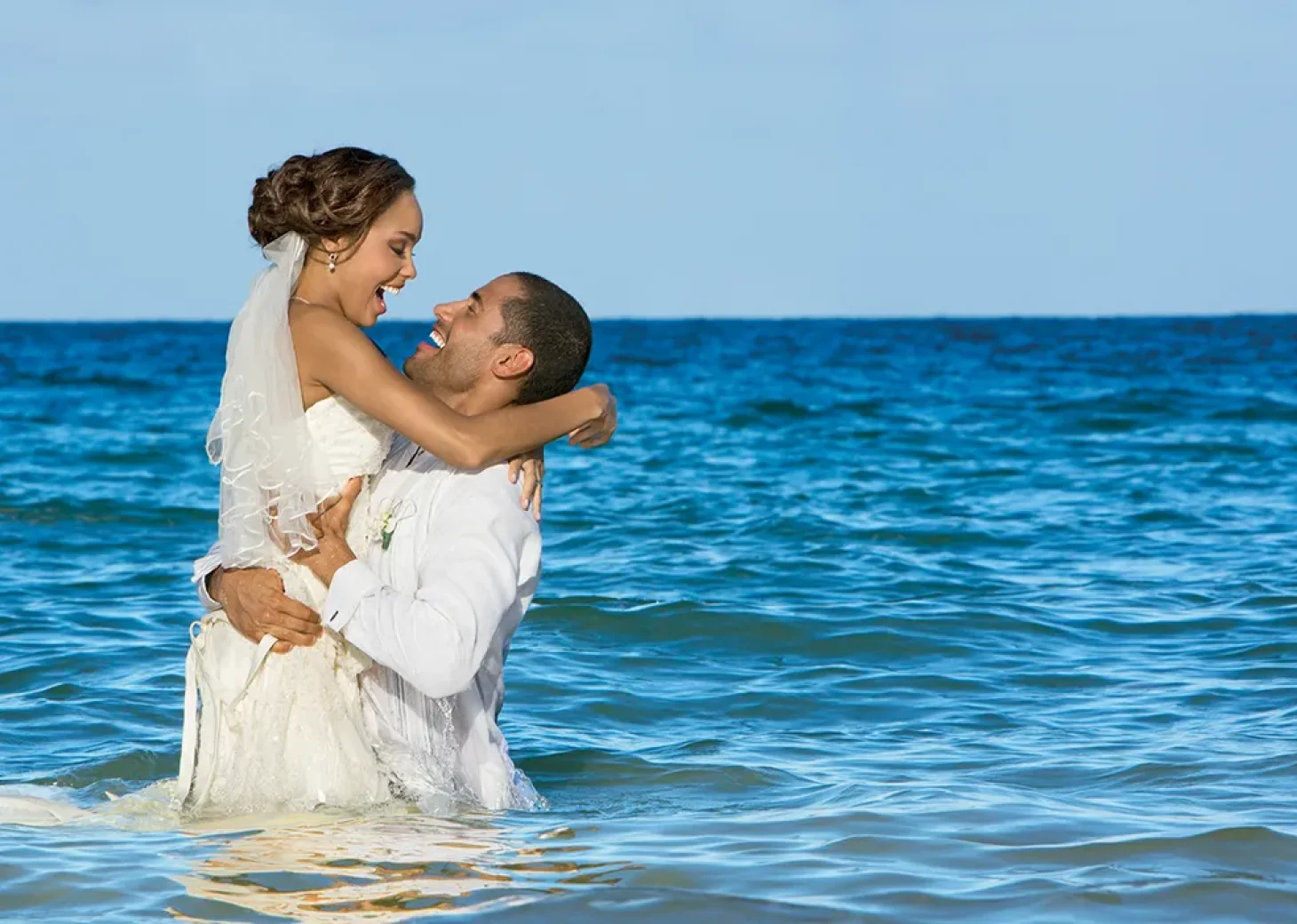 Couple on the beach at Secrets Wild Orchid