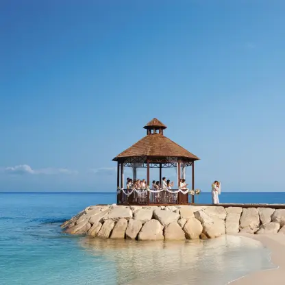 Oceanfront wedding ceremony at a gazebo on the pier at Secrets Wild Orchid, Montego Bay