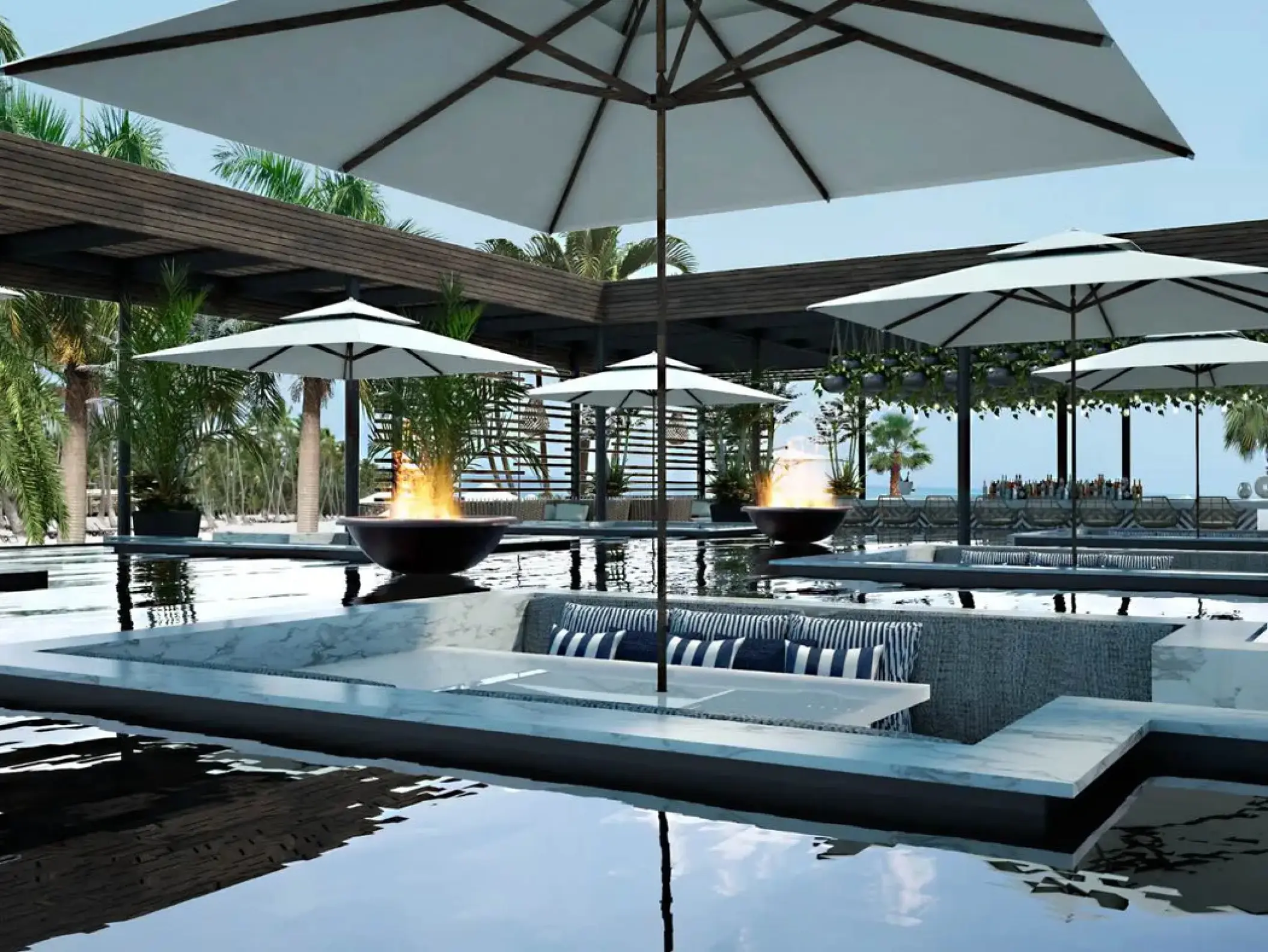 SLS Playa Mujeres adults-only pool with sunken lounge seating and fire pits, Cancun