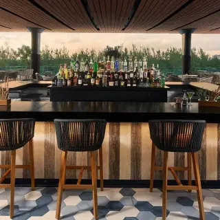 Rooftop cocktail bar at SLS Playa Mujeres overlooking the jungle, Cancun