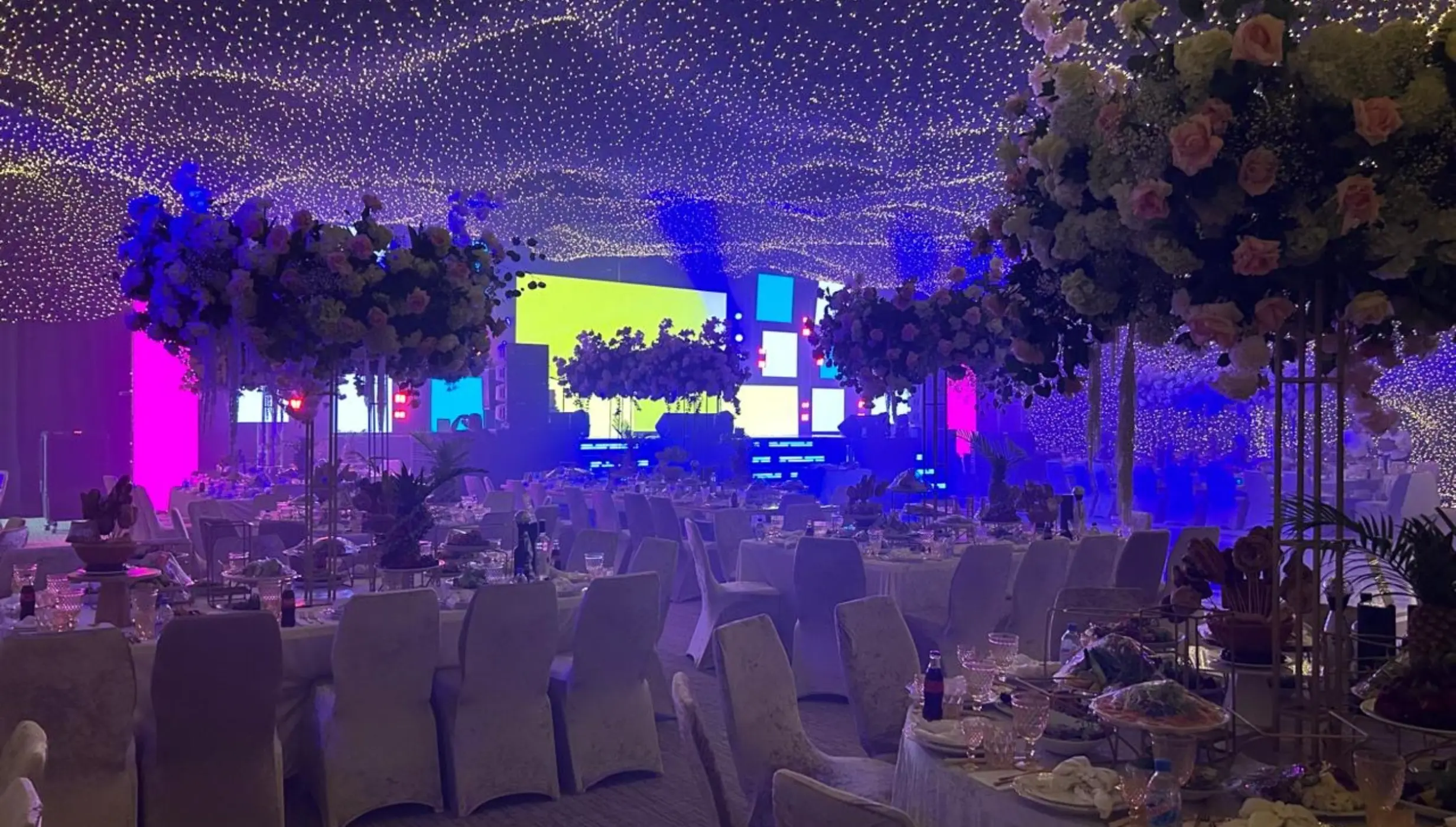 Indoor wedding reception in the Grand Ballroom at SLS Playa Mujeres, Cancun with fairy light ceiling