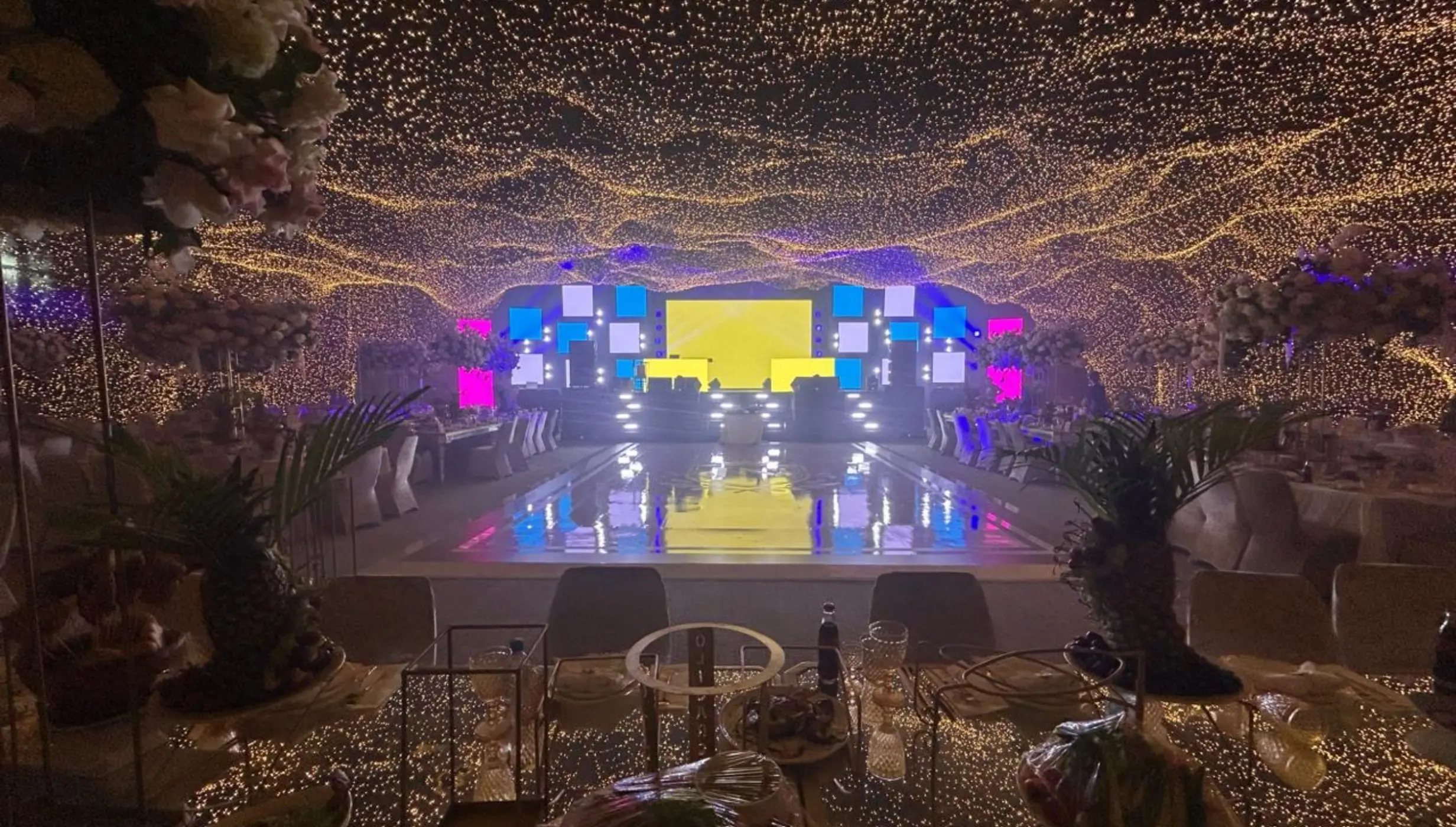 Grand Ballroom wedding reception with ceiling fairy lights and dance floor at SLS Playa Mujeres, Cancun
