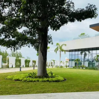 Marina Lawn wedding venue with green grass and modern architecture at SLS Playa Mujeres, Cancun