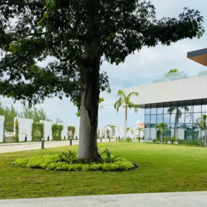 Marina Lawn wedding venue with green grass and modern architecture at SLS Playa Mujeres, Cancun