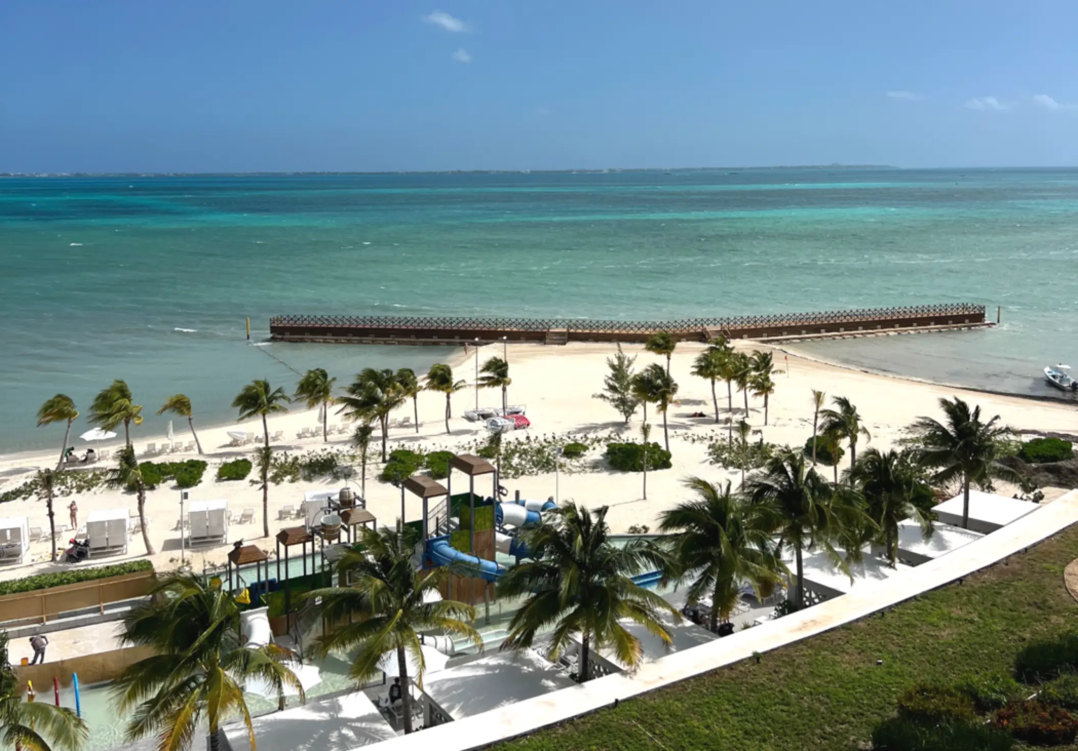 Aerial view of the beach and private pier at SLS Playa Mujeres, Cancun