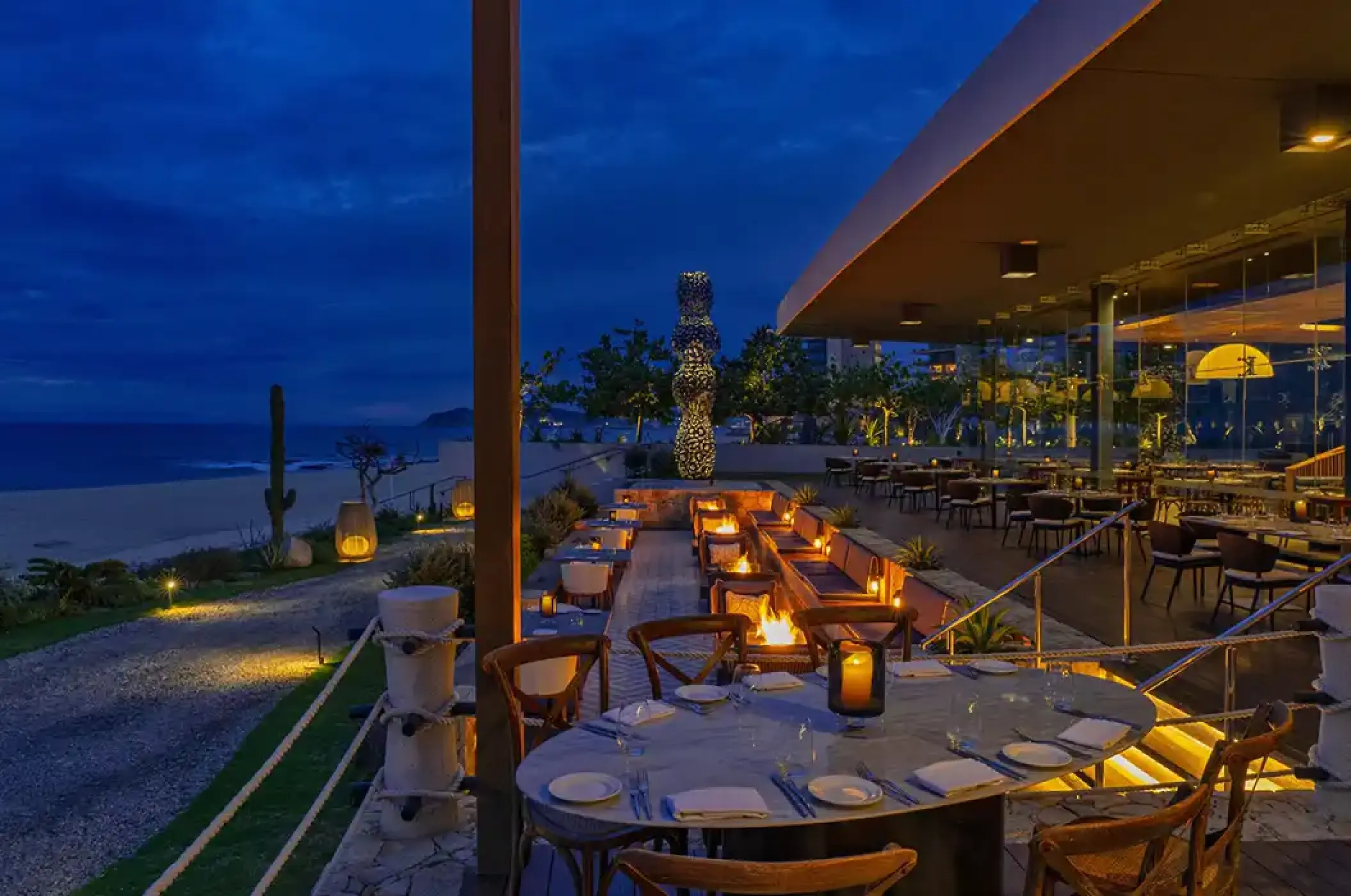 Outdoor dining area with fire pits at Solaz Los Cabos, Cabo San Lucas