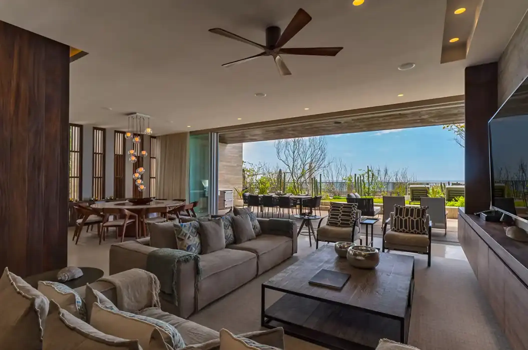 Solaz Los Cabos King Residence living area opening to a terrace, Cabo San Lucas