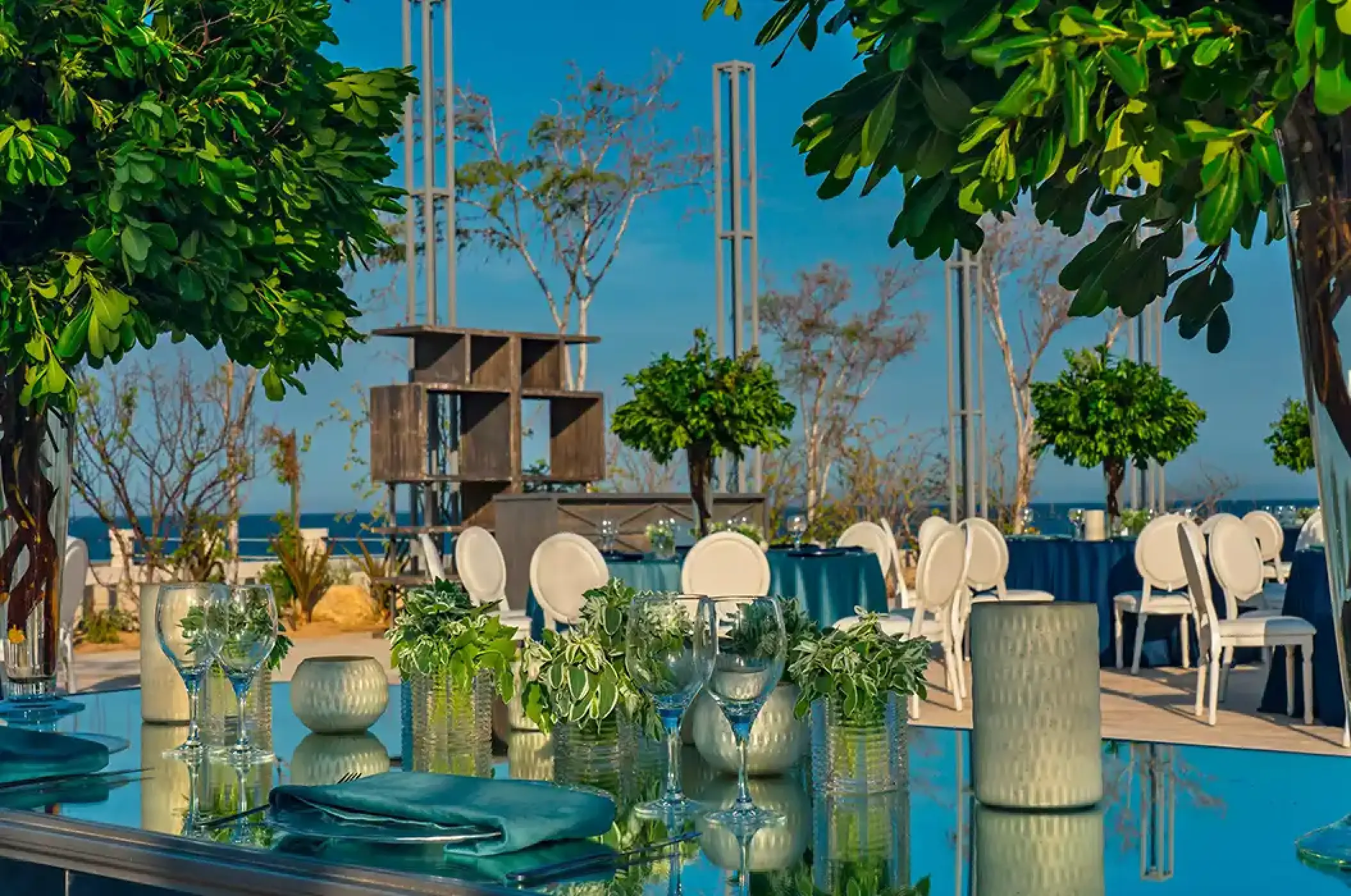 Outdoor wedding reception setup with ocean views at Solaz Los Cabos, Cabo San Lucas