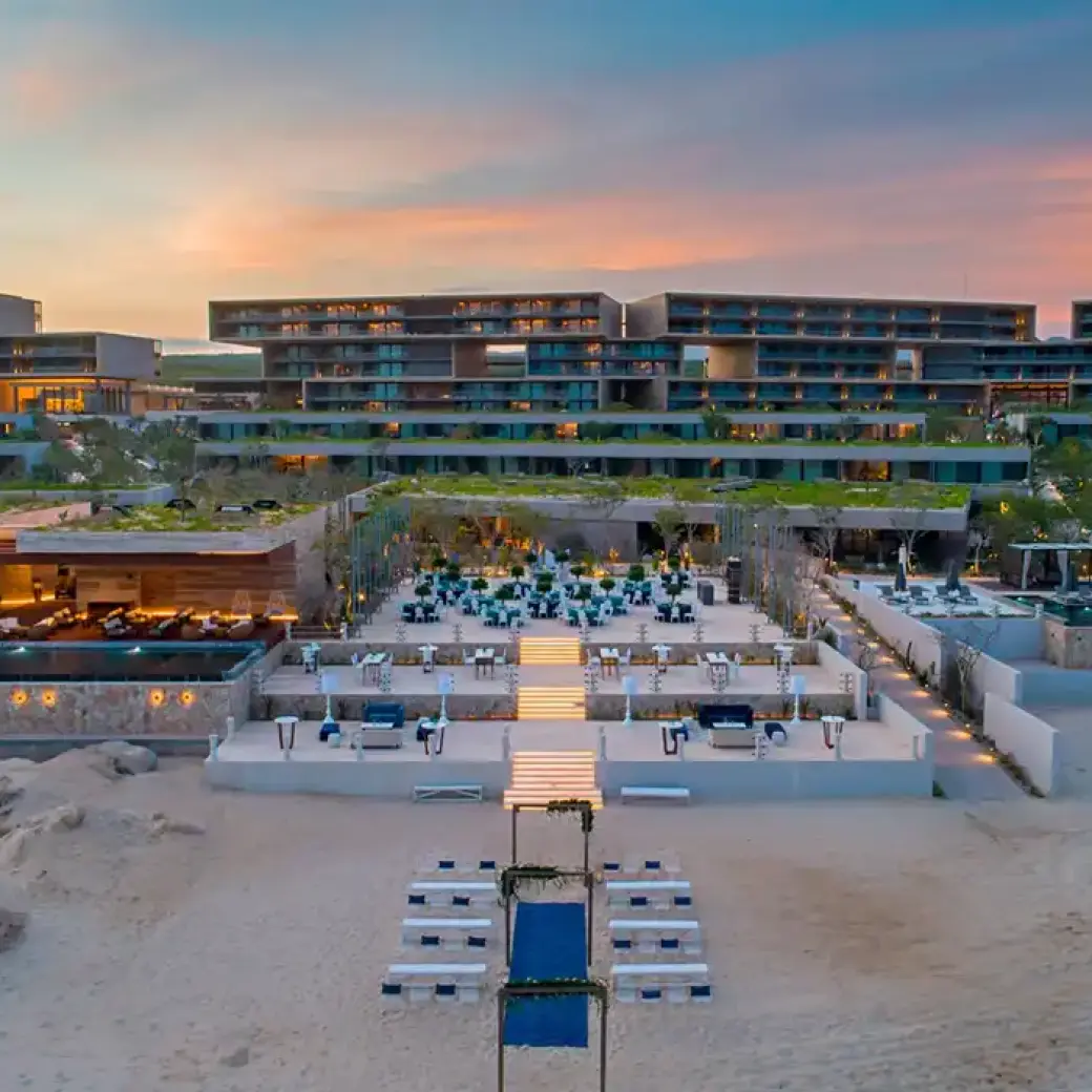 Aerial view of the modern beachfront exterior and tiered terraces at Solaz Los Cabos, Cabo San Lucas
