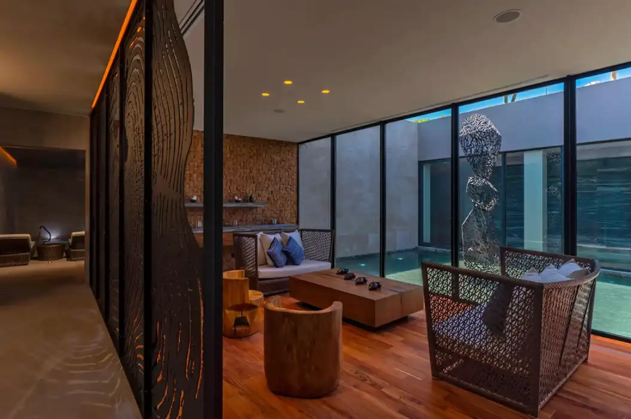 Modern Ojo de Liebre spa lounge with floor-to-ceiling windows at Solaz Los Cabos, Cabo San Lucas