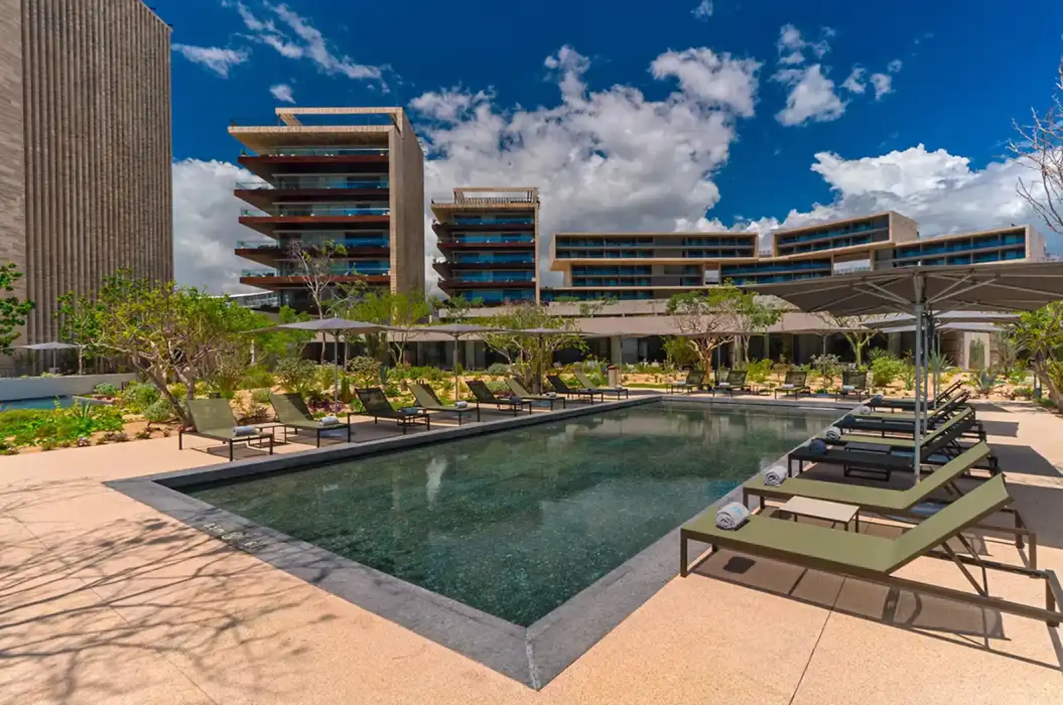 Solaz Los Cabos outdoor pool and tiered modern buildings, Cabo San Lucas