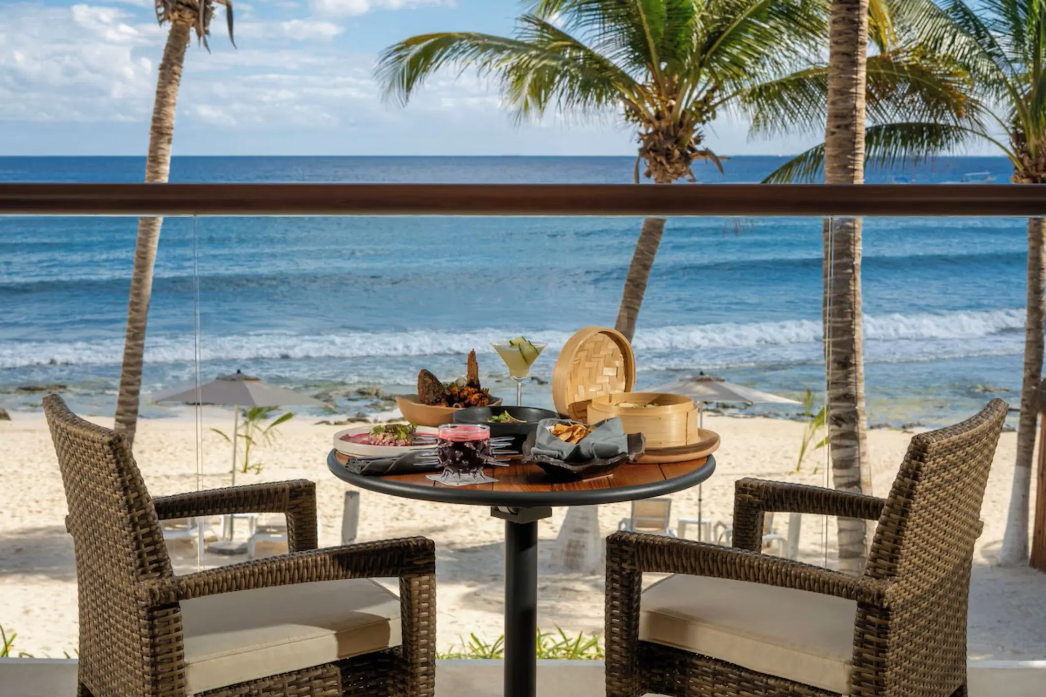 delicious room service breakfast kept on oceanfront balcony table at The Beachfront by The Fives