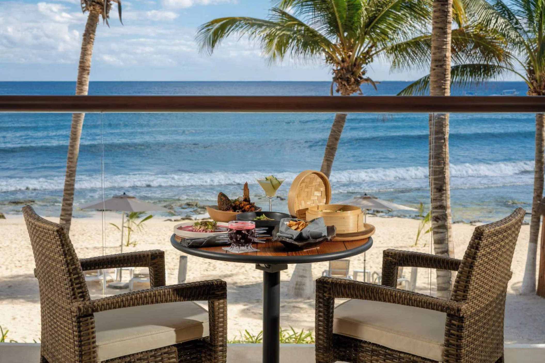 delicious room service breakfast kept on oceanfront balcony table at The Beachfront by The Fives