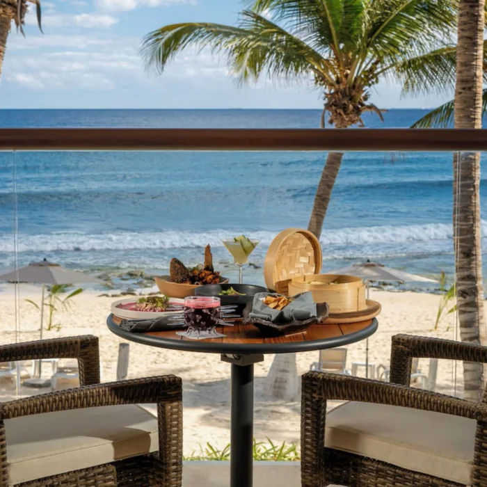 delicious room service breakfast kept on oceanfront balcony table at The Beachfront by The Fives